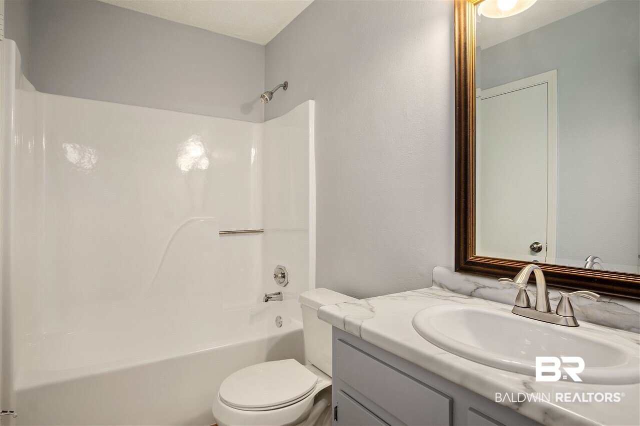 200 Parma Drive, Unit N1 Daphne, AL 36526 - Photo 13 of 24 Master Bath has a second half with hall access