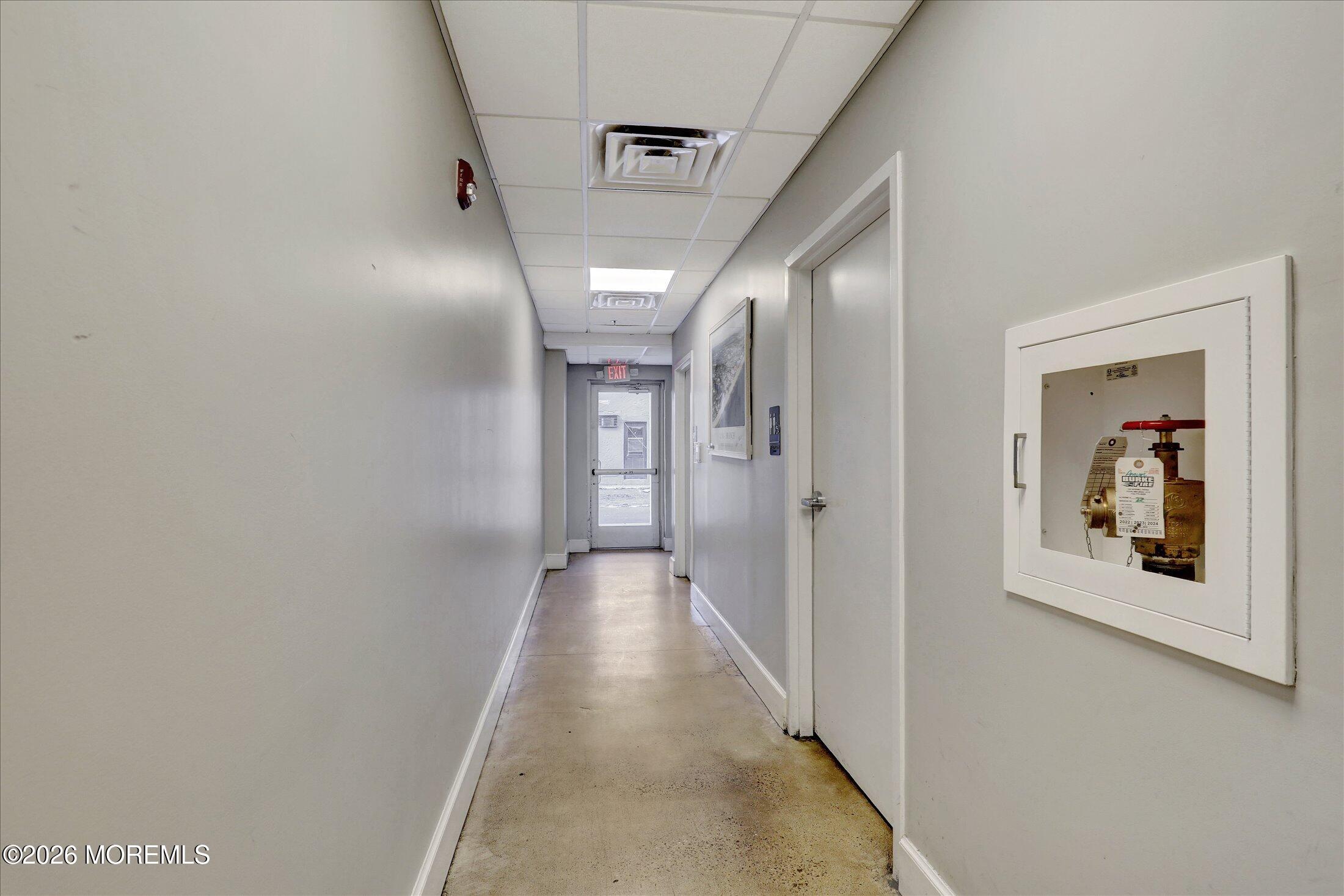 55 Brighton Avenue, Unit 4 Long Branch, NJ 07740 - Photo 28 of 36 a view of a hallway view with wooden floor and staircase
