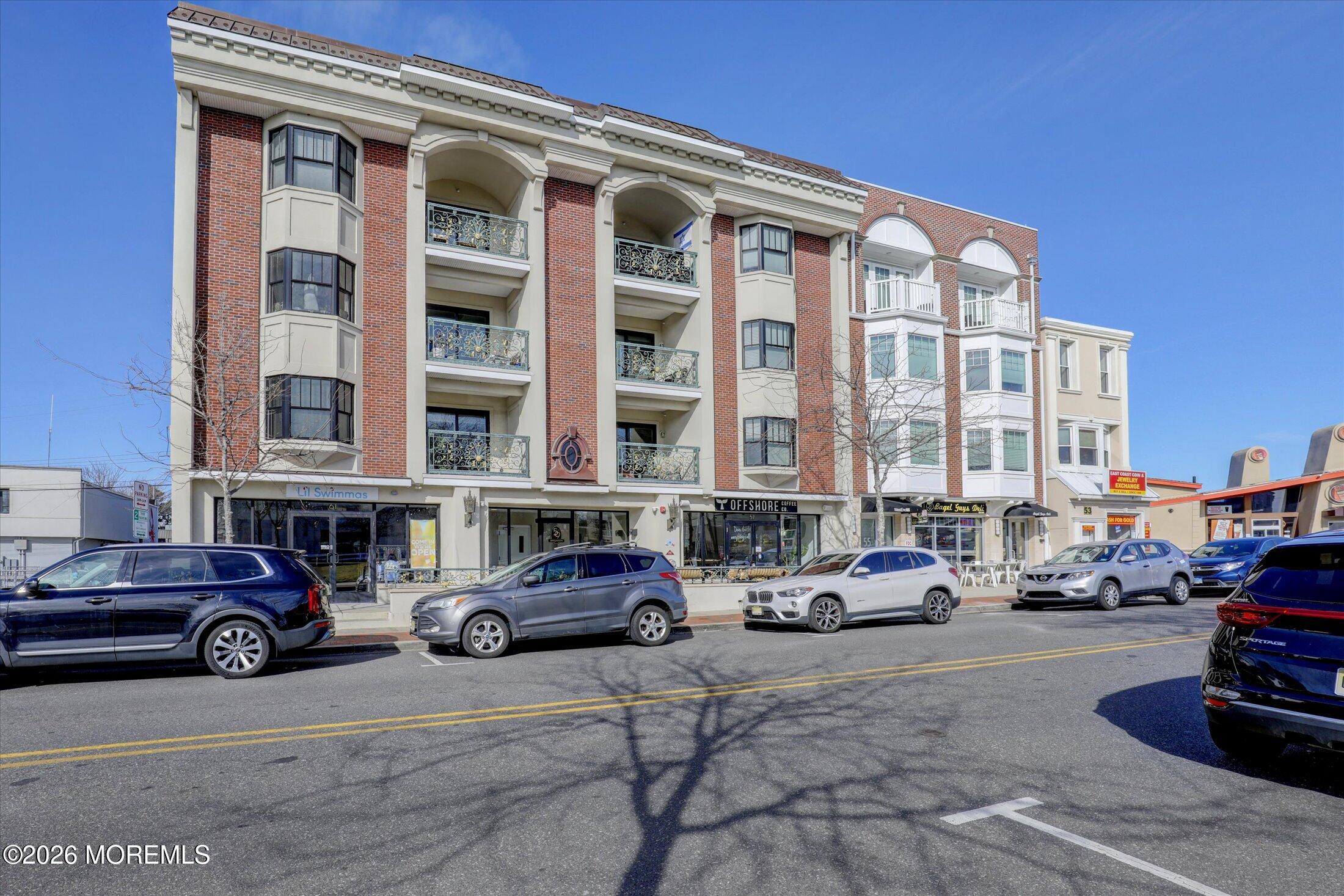 55 Brighton Avenue, Unit 4 Long Branch, NJ 07740 - Photo 3 of 36 a buildings and cars parked in front of a building