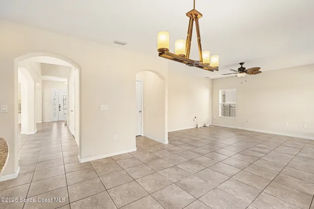 a view of swimming pool with a backyard and trees