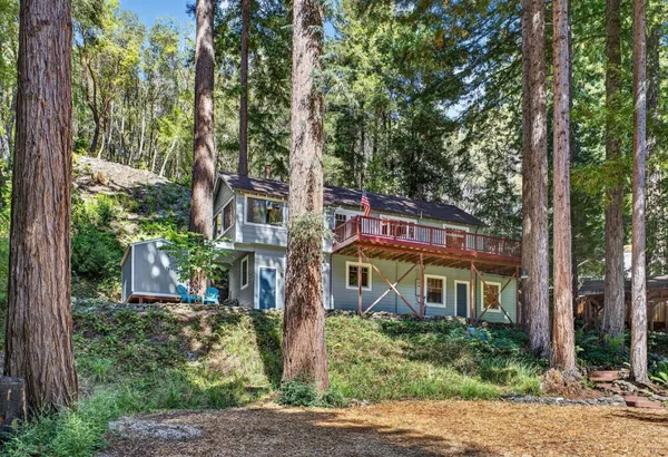 a front view of a residential apartment building with a yard
