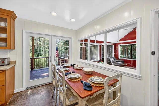 a view of a dining room with furniture window and outside view