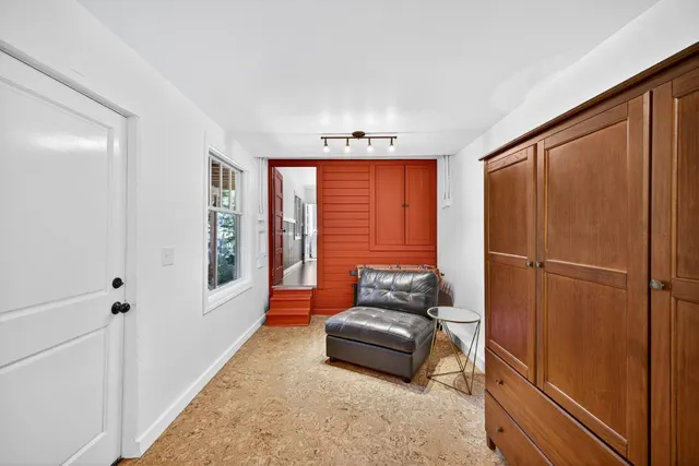 a bedroom with furniture and a window