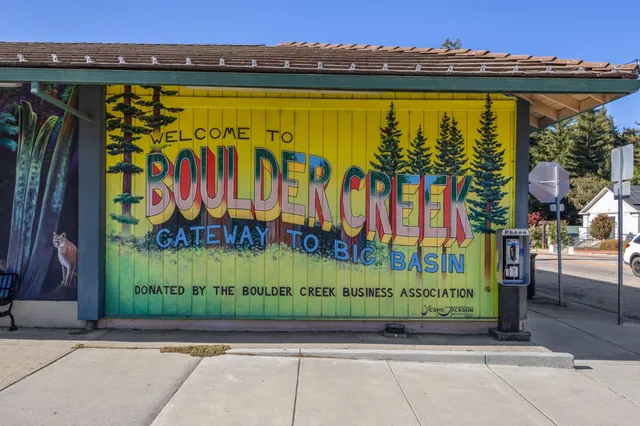 a view of a street with an outdoor seating