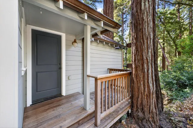 a view of a porch with wooden floor and stairs
