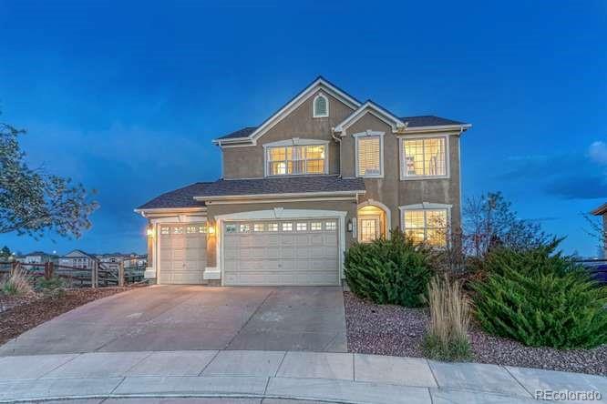 12365 Point Reyes Drive Peyton, CO 80831 - Photo 1 of 44 a front view of a house with a yard