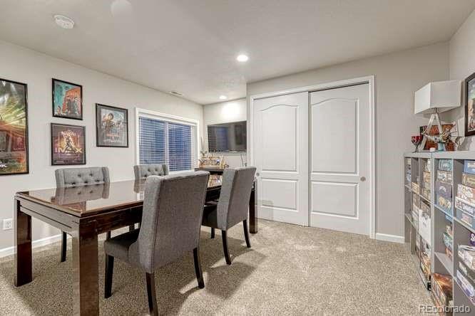 12365 Point Reyes Drive Peyton, CO 80831 - Photo 30 of 44 a view of a dining room with furniture