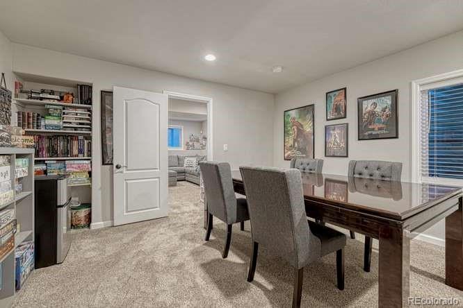 12365 Point Reyes Drive Peyton, CO 80831 - Photo 31 of 44 a view of a dining room with furniture