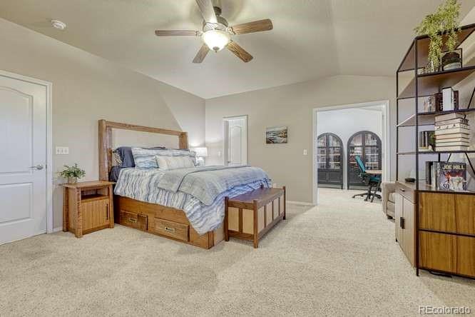 12365 Point Reyes Drive Peyton, CO 80831 - Photo 4 of 44 a bedroom with bed and a book shelf