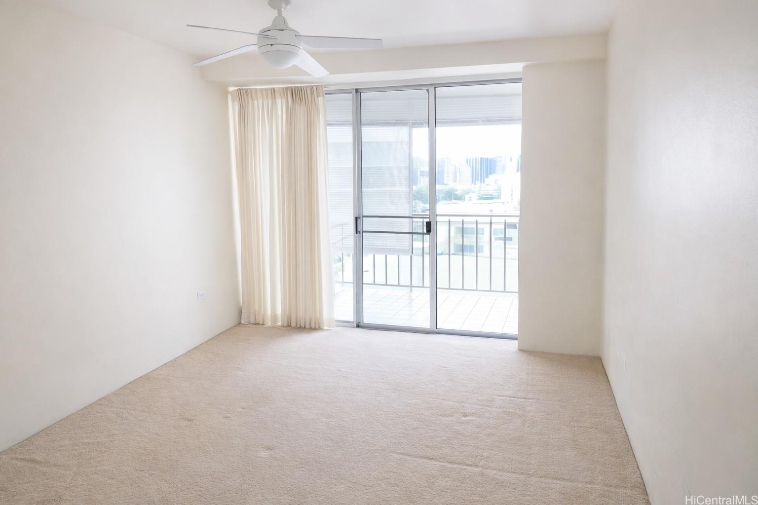 1415 Victoria Street, Unit 906 Honolulu, HI 96822 - Photo 12 of 16 a view of an empty room with a window