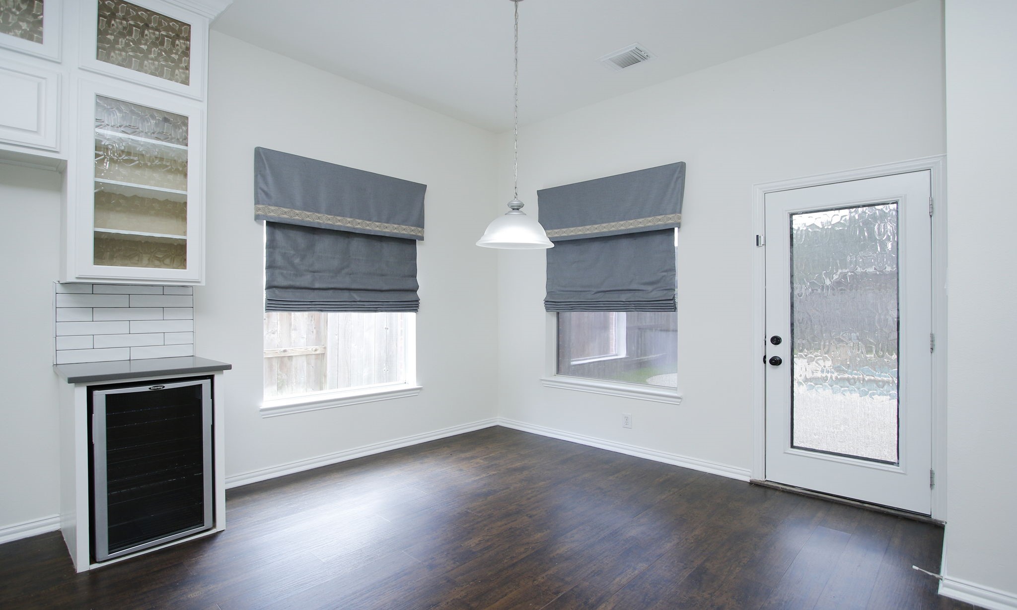 1210 Berwick Manor Court Spring, TX 77379 - Photo 26 of 50 an empty room with wooden floor and windows
