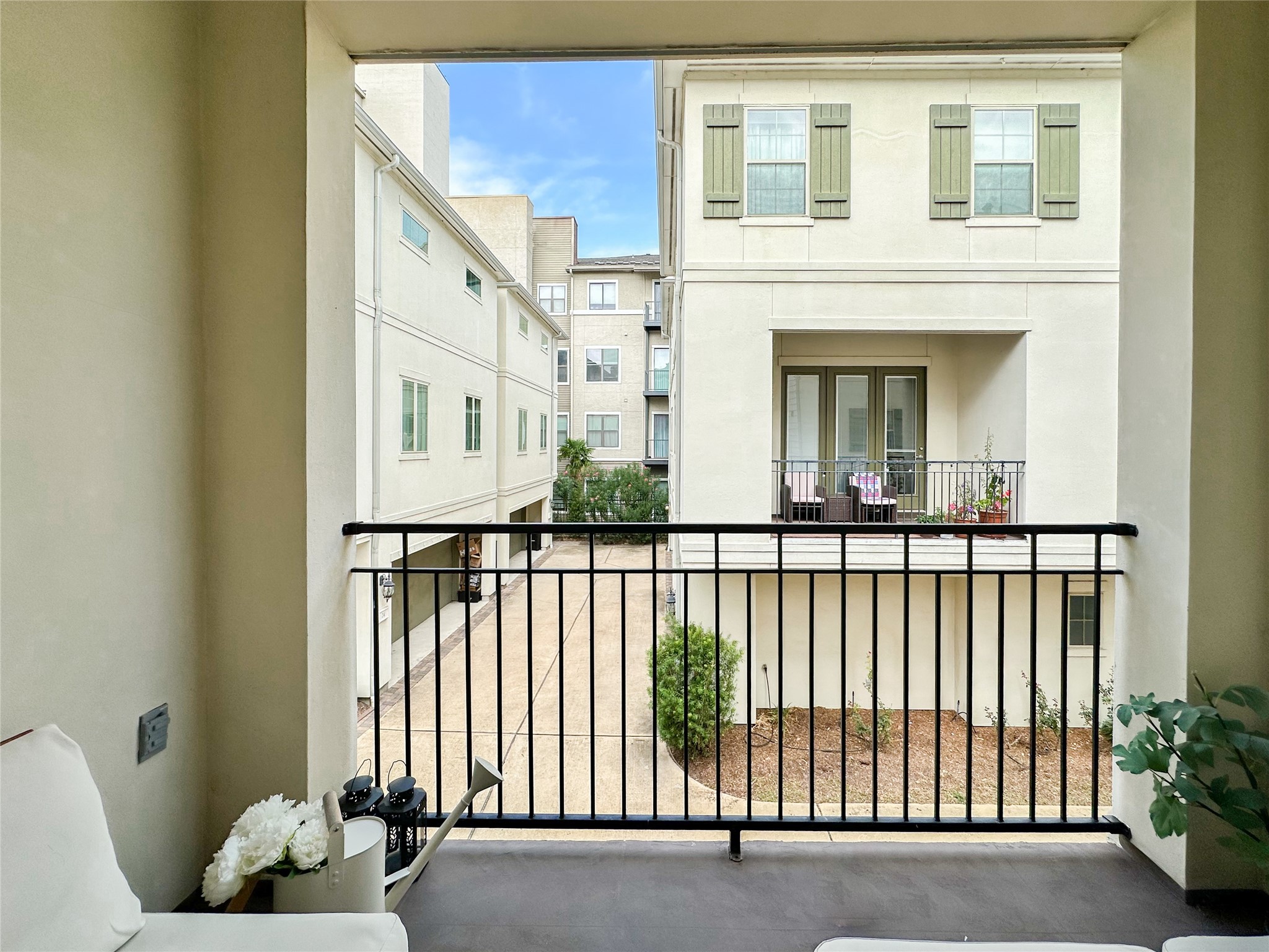 2 Hermann Park Court Houston, TX 77021 - Photo 21 of 43 a view of a brick house with large windows and flower plants