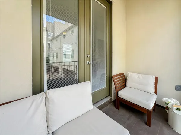 a bedroom with furniture and flat screen tv