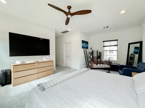 a bedroom with furniture and window