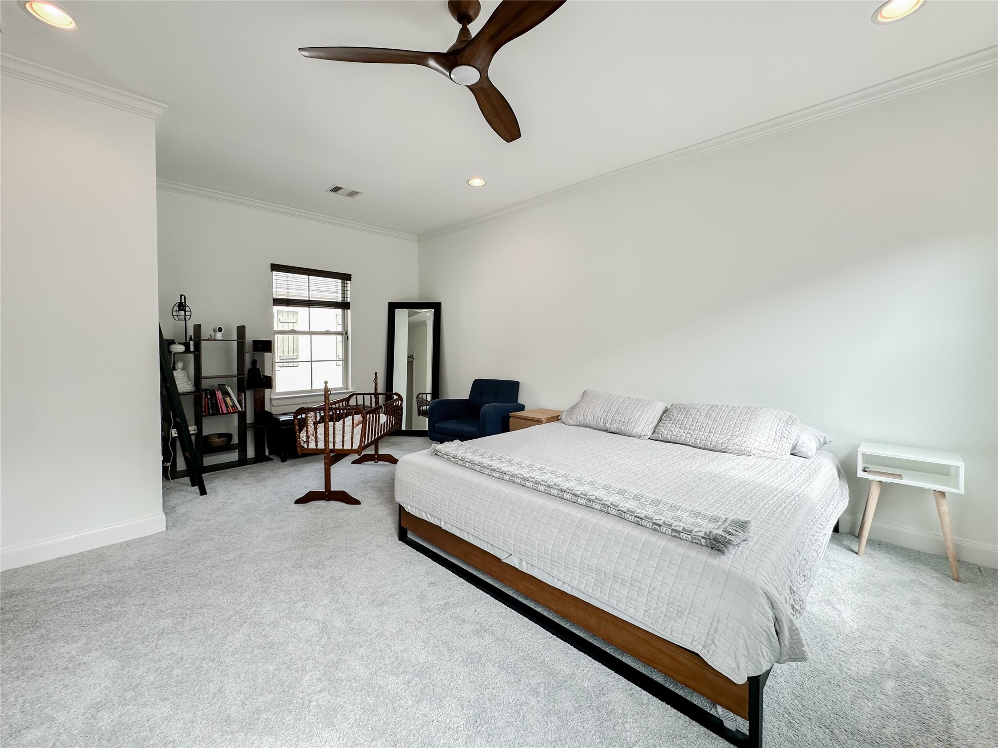 2 Hermann Park Court Houston, TX 77021 - Photo 25 of 43 a spacious bedroom with a bed and window