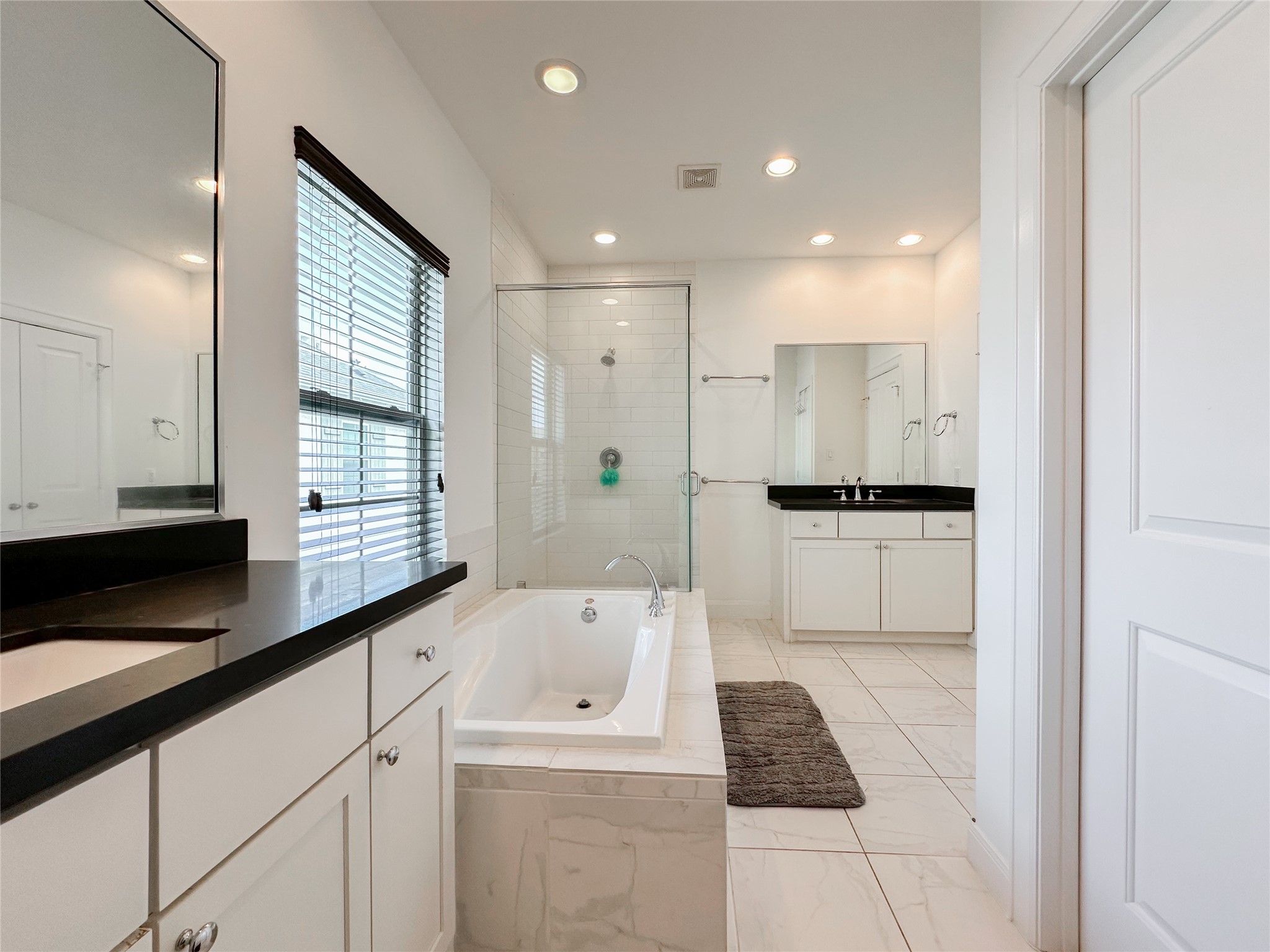 2 Hermann Park Court Houston, TX 77021 - Photo 26 of 43 a kitchen with granite countertop white cabinets and white appliances