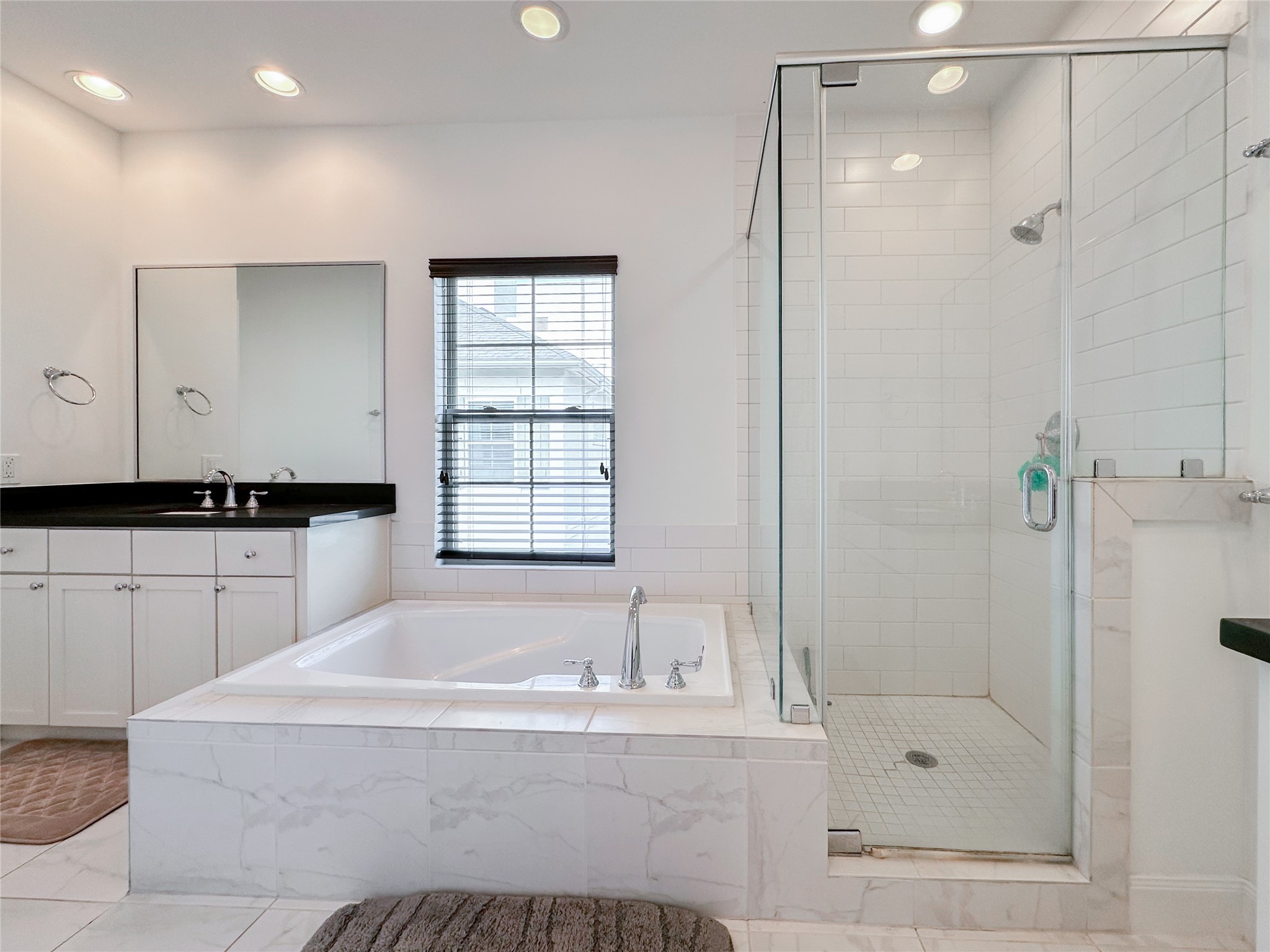 2 Hermann Park Court Houston, TX 77021 - Photo 28 of 43 a bathroom with a bathtub and a shower