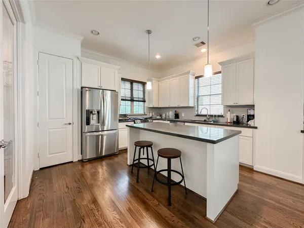 a kitchen with a sink cabinets and window