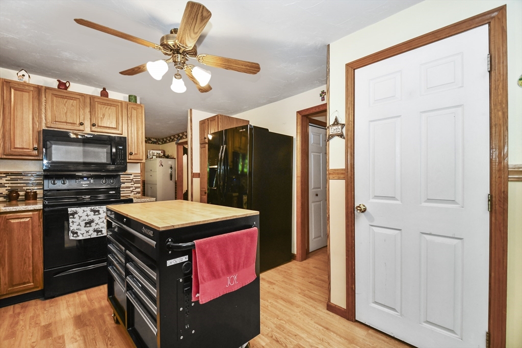 549 Chestnut Hill Road Millville, MA 01529 - Photo 12 of 38 a kitchen with stainless steel appliances granite countertop a refrigerator a stove and a sink