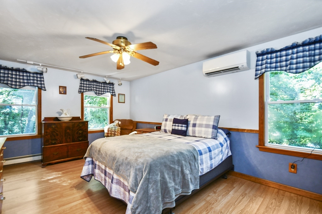 549 Chestnut Hill Road Millville, MA 01529 - Photo 16 of 38 a bedroom with double bed and a window