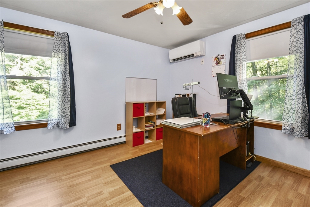 549 Chestnut Hill Road Millville, MA 01529 - Photo 21 of 38 a view of workspace with wooden floor and windows