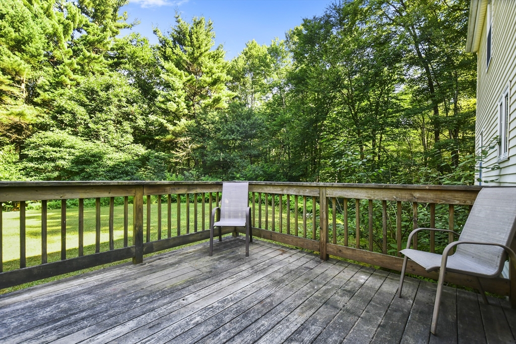 549 Chestnut Hill Road Millville, MA 01529 - Photo 26 of 38 a view of balcony with wooden floor and outdoor seating