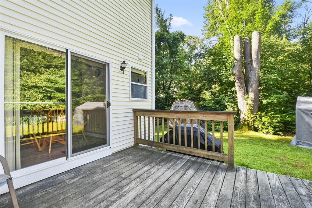 549 Chestnut Hill Road Millville, MA 01529 - Photo 27 of 38 a view of a wooden deck and a yard