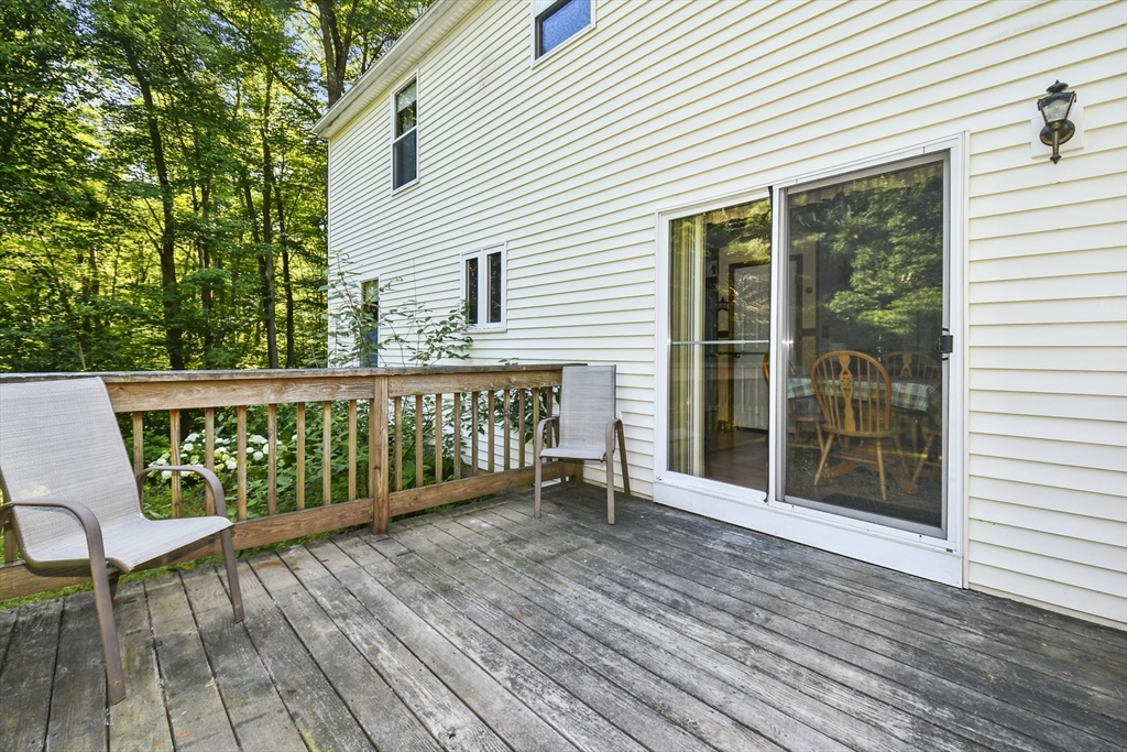 549 Chestnut Hill Road Millville, MA 01529 - Photo 28 of 38 a view of a wooden chairs on deck