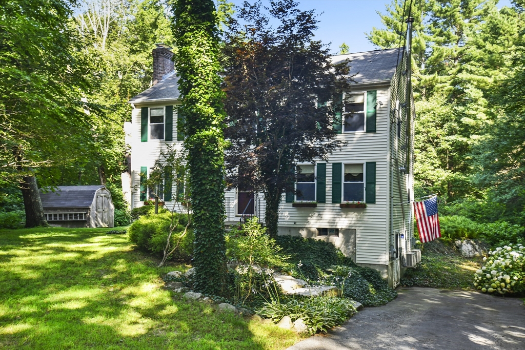 549 Chestnut Hill Road Millville, MA 01529 - Photo 32 of 38 a view of a house with a yard and sitting area