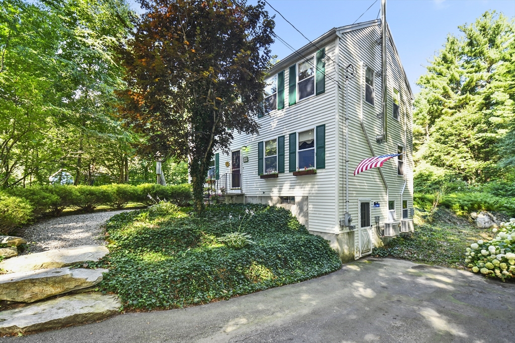 549 Chestnut Hill Road Millville, MA 01529 - Photo 33 of 38 a front view of a house with garden