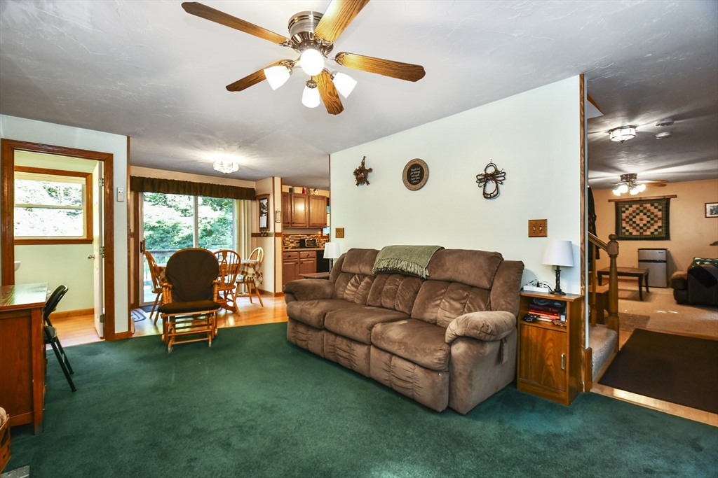 549 Chestnut Hill Road Millville, MA 01529 - Photo 35 of 38 a living room with furniture and a floor to ceiling window