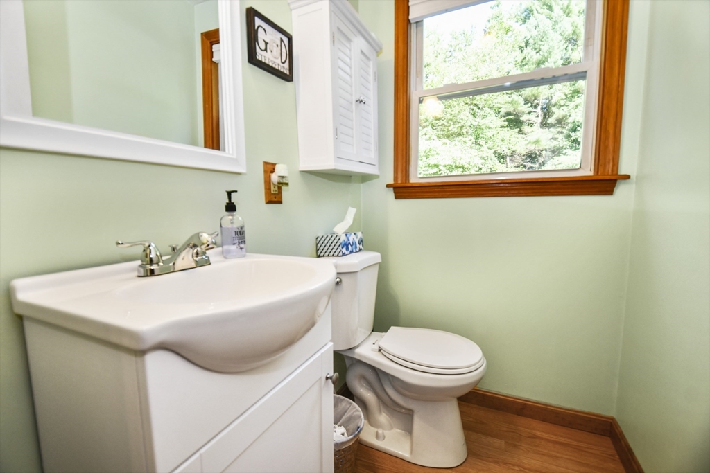 549 Chestnut Hill Road Millville, MA 01529 - Photo 8 of 38 a bathroom with a sink a toilet and a window
