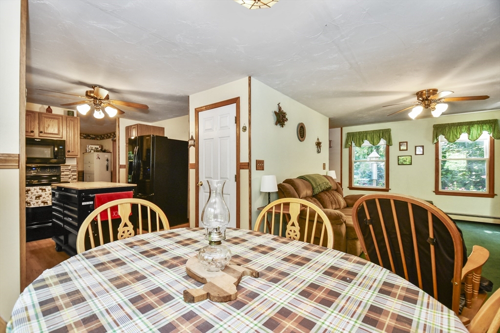 549 Chestnut Hill Road Millville, MA 01529 - Photo 10 of 38 a bedroom with a bed and a large mirror on the dresser