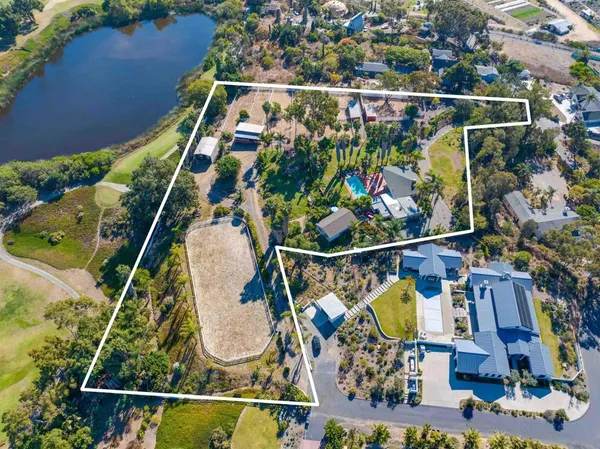 an aerial view of houses with street