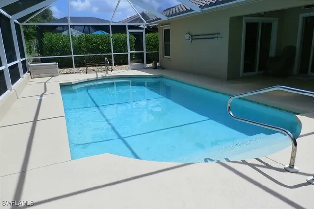 a view of a backyard with a swimming pool