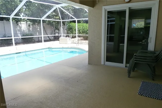 a view of a room with wooden floor and a dining room