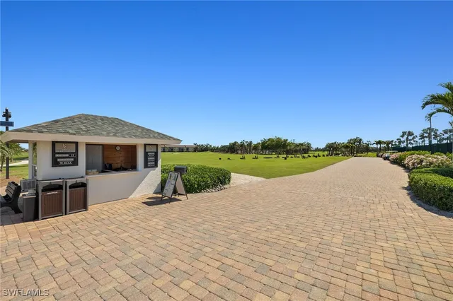 a view of a house with pool and a yard
