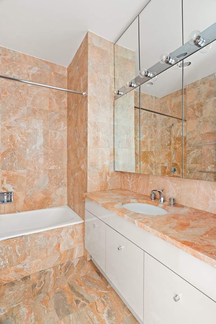200-210 East 65th Street, Unit 30E Manhattan, NY 10065 - Photo 11 of 17 a bathroom with a sink and a shower