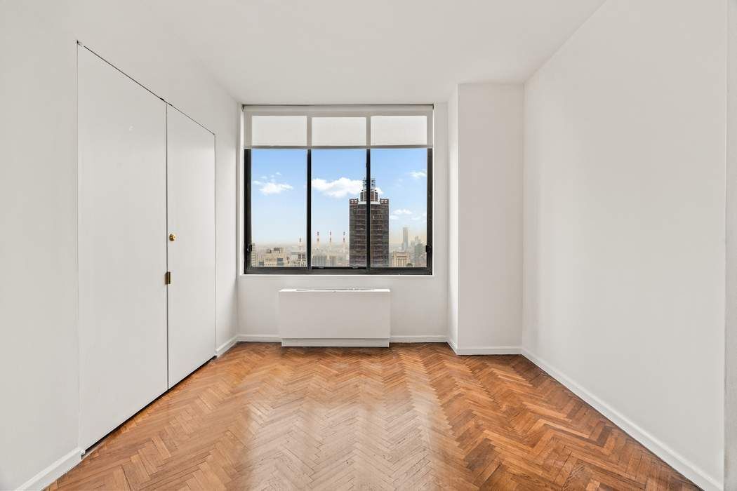 200-210 East 65th Street, Unit 30E Manhattan, NY 10065 - Photo 13 of 17 a view of an empty room with window