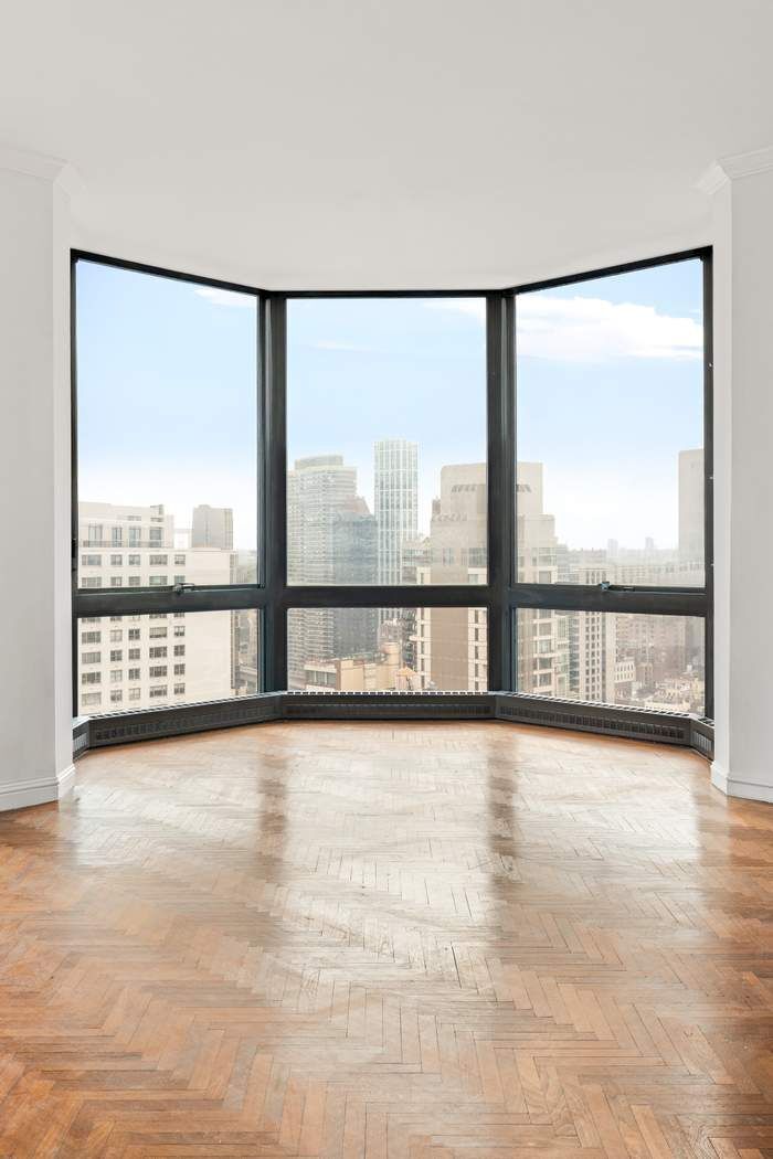 200-210 East 65th Street, Unit 30E Manhattan, NY 10065 - Photo 6 of 17 a view of an empty room and window