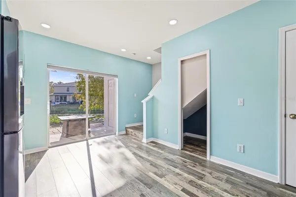 a room with a bed and a large window