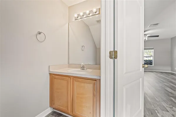 a bathroom with a sink and mirror