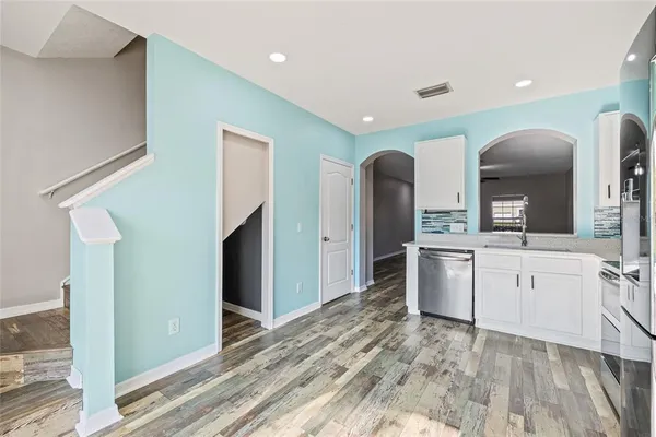 a large bathroom with a sink mirror and a shower