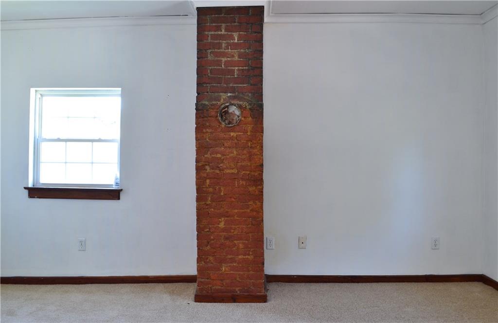 62 Statement Street Washington, PA 15301 - Photo 20 of 23 Bedroom 2 continues boasting the exposed brick.