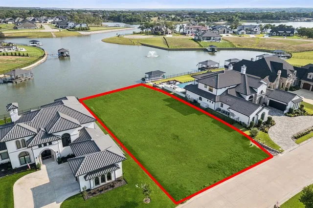 an aerial view of a house with a ocean view