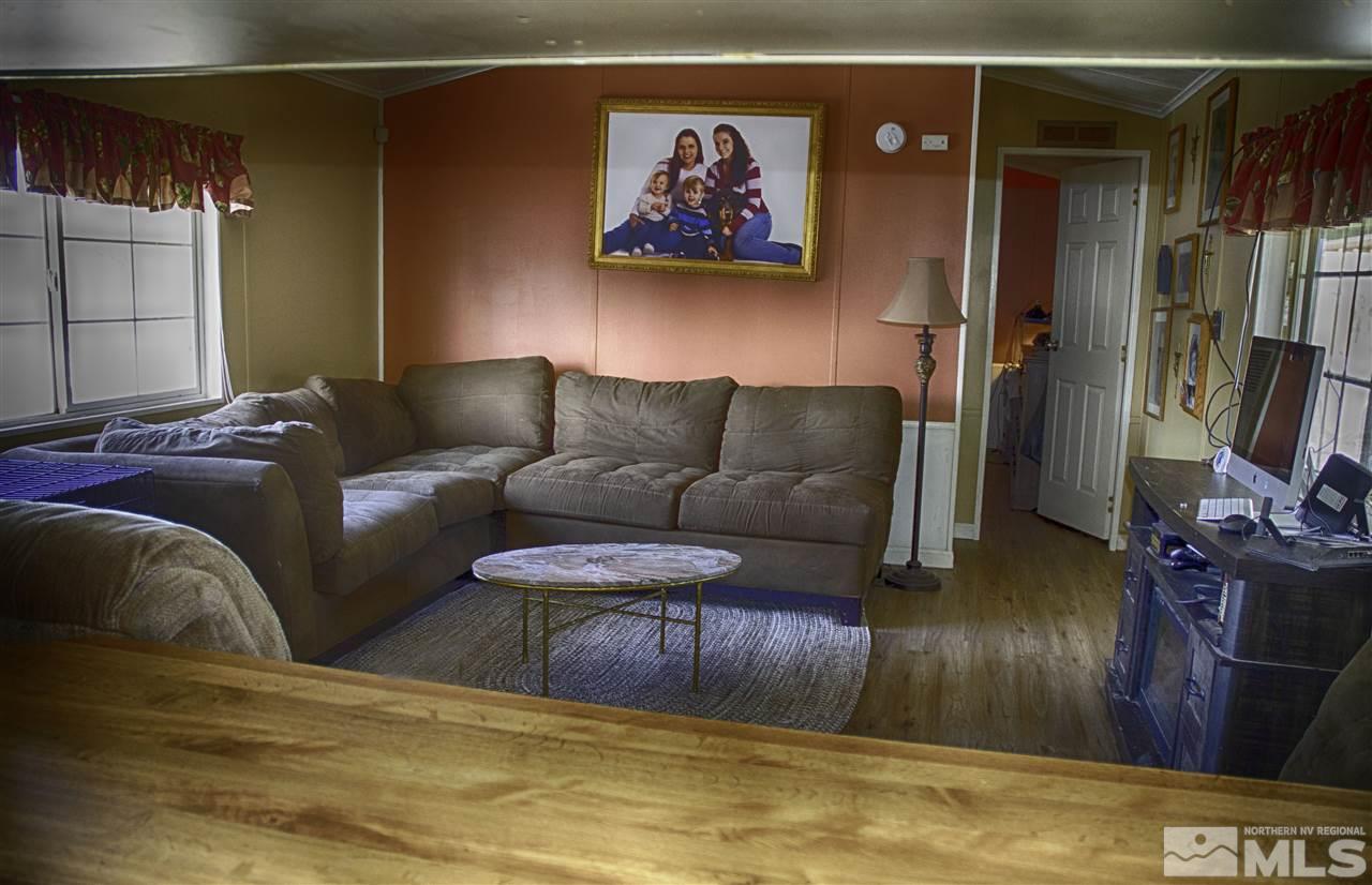 1465 Kate Lane Reno, NV 89506 - Photo 3 of 10 a living room with furniture and a flat screen tv