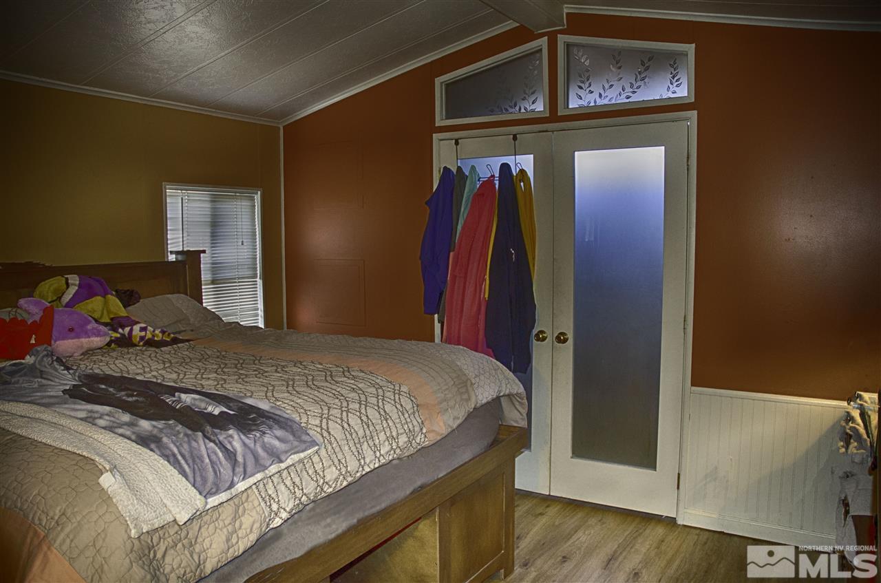 1465 Kate Lane Reno, NV 89506 - Photo 4 of 10 a bedroom with a bed and a dresser