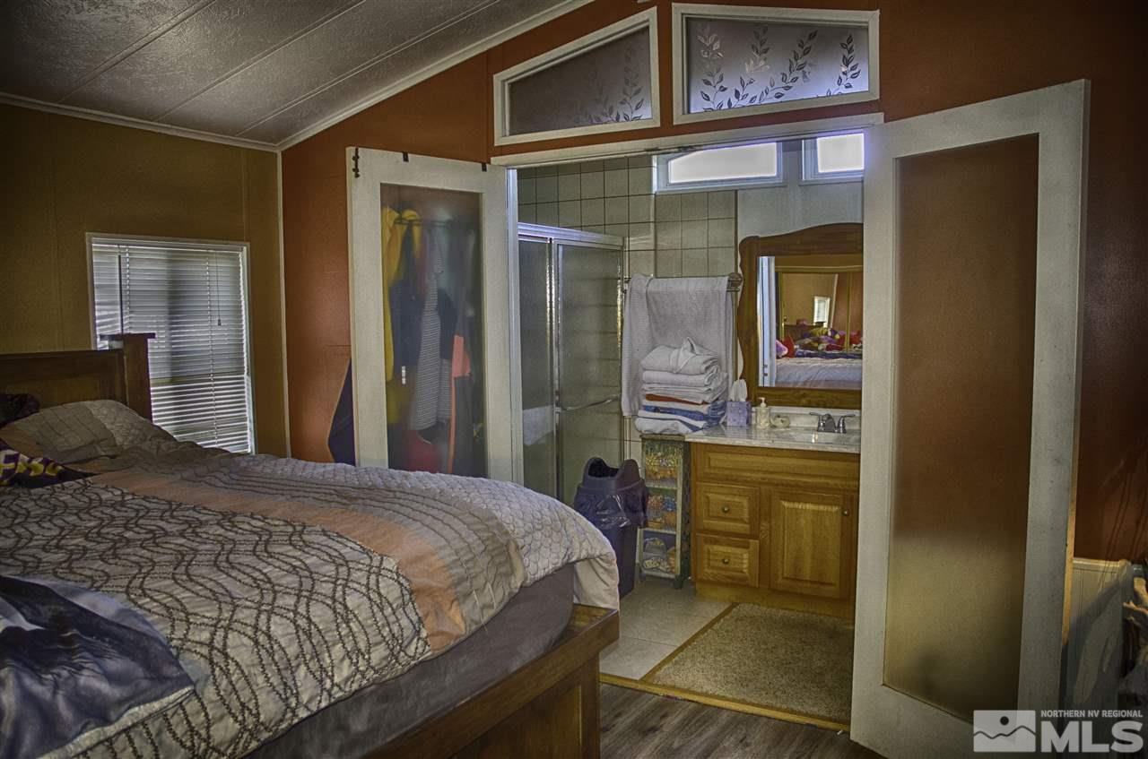 1465 Kate Lane Reno, NV 89506 - Photo 5 of 10 a bedroom with a bed and a cabinets