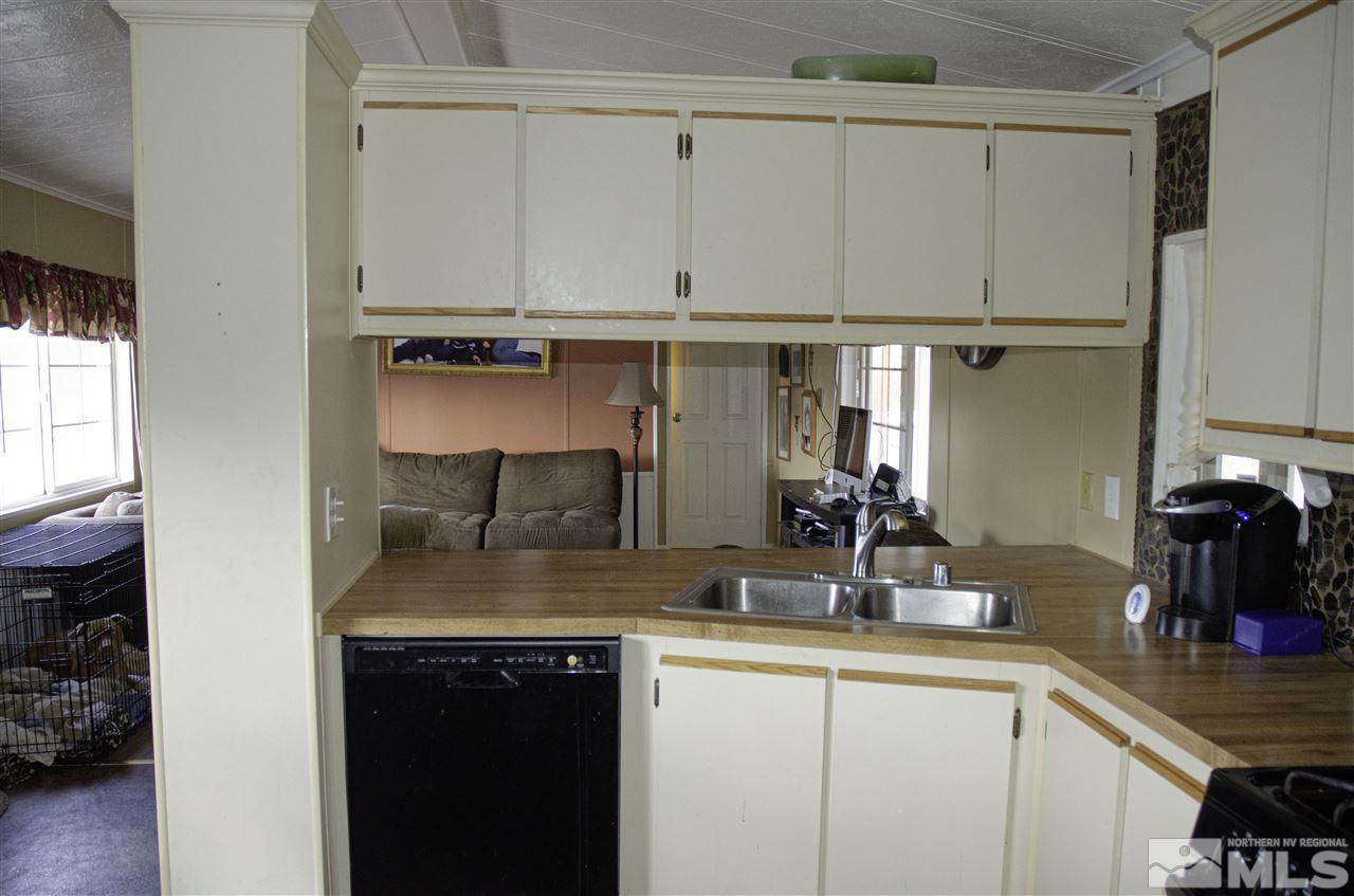 1465 Kate Lane Reno, NV 89506 - Photo 7 of 10 a kitchen with a sink and cabinets