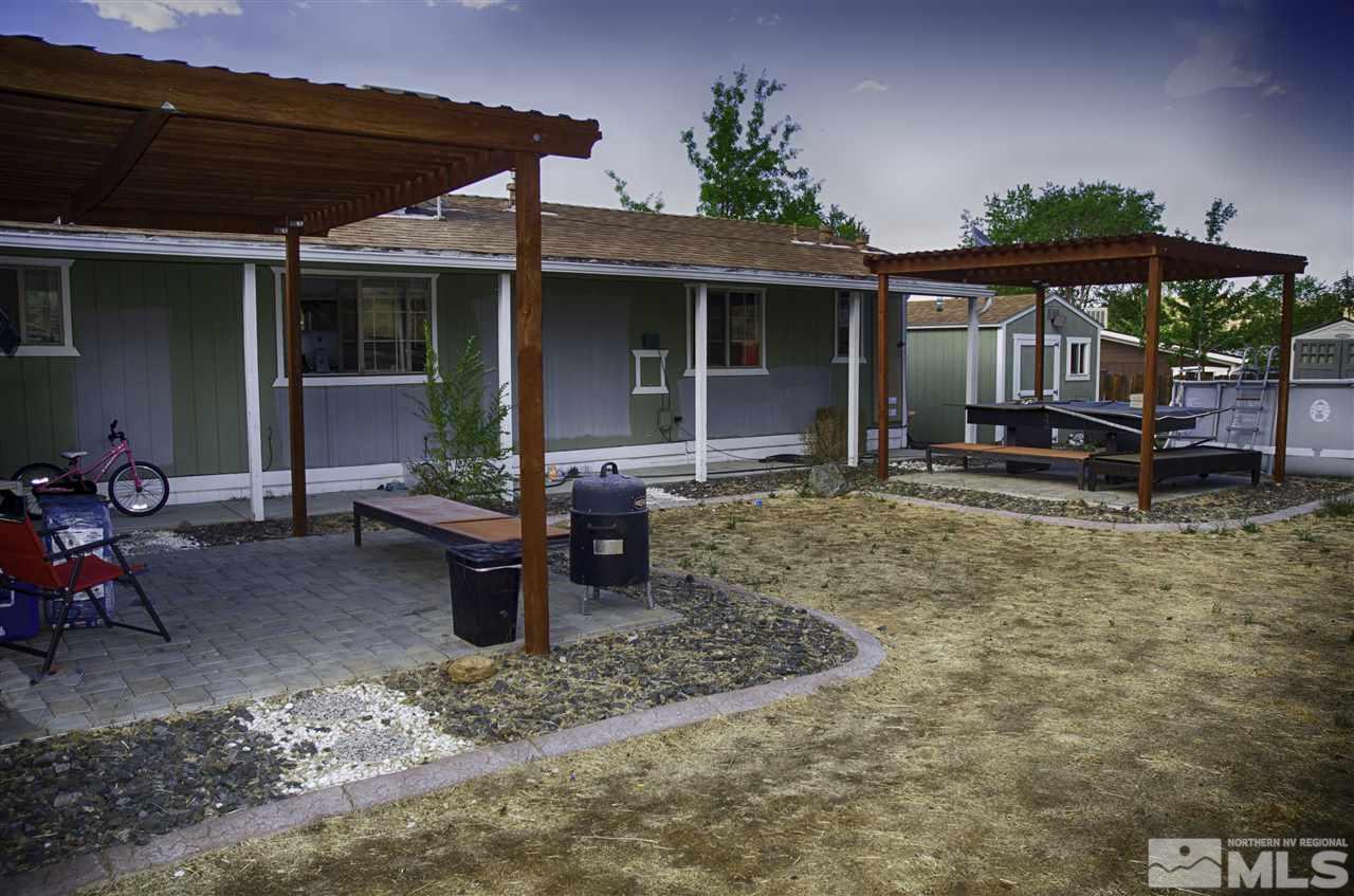 1465 Kate Lane Reno, NV 89506 - Photo 8 of 10 a backyard of a house with yard fire pit and outdoor seating